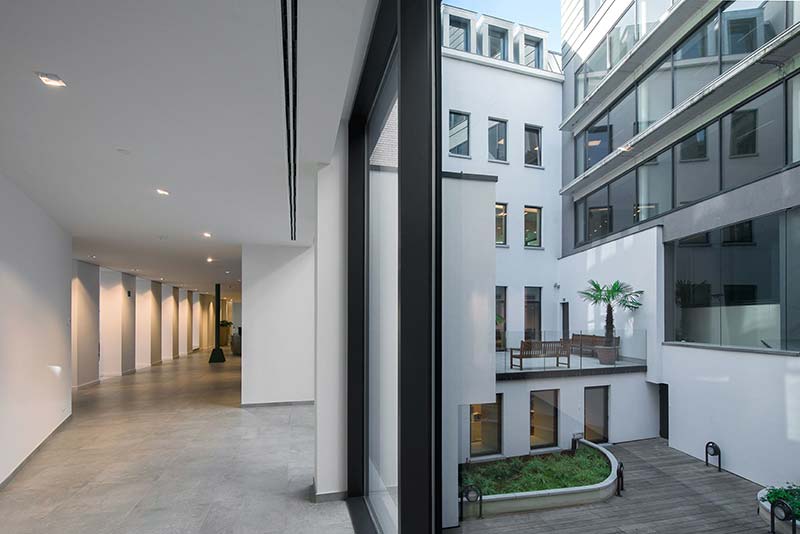 Sculptural staircase brings old and new together in historic Brussels building