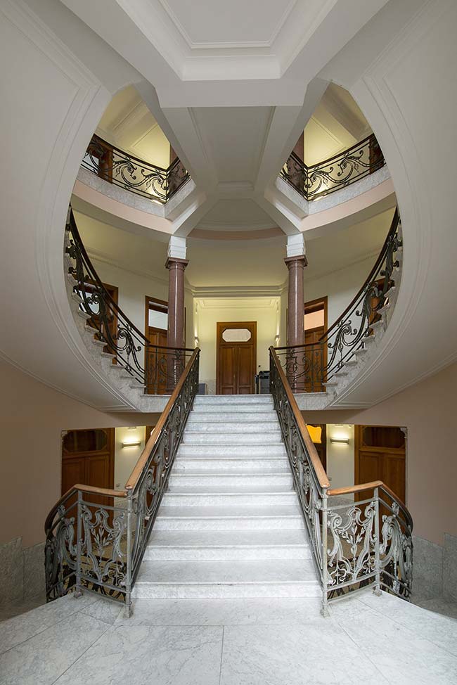 Sculptural staircase brings old and new together in historic Brussels building
