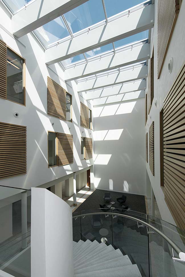 Sculptural staircase brings old and new together in historic Brussels building