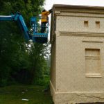 Artist Ian Strange covers historical building in over 600 sq metres of gold wallpaper