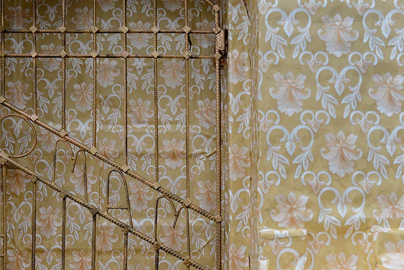 Artist Ian Strange covers historical building in over 600 sq metres of gold wallpaper