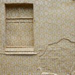 Artist Ian Strange covers historical building in over 600 sq metres of gold wallpaper