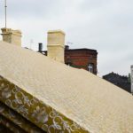 Artist Ian Strange covers historical building in over 600 sq metres of gold wallpaper