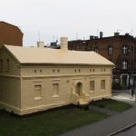 Artist Ian Strange covers historical building in over 600 sq metres of gold wallpaper