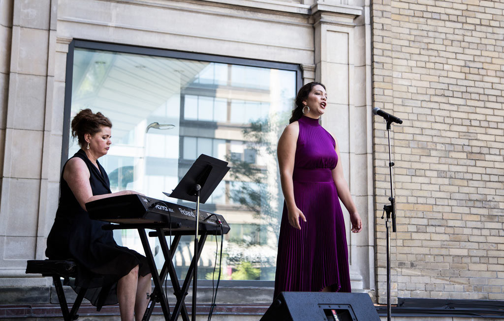 Jennifer Routhier performs onstage at the Helga and Mike Schmidt Performance Terrace