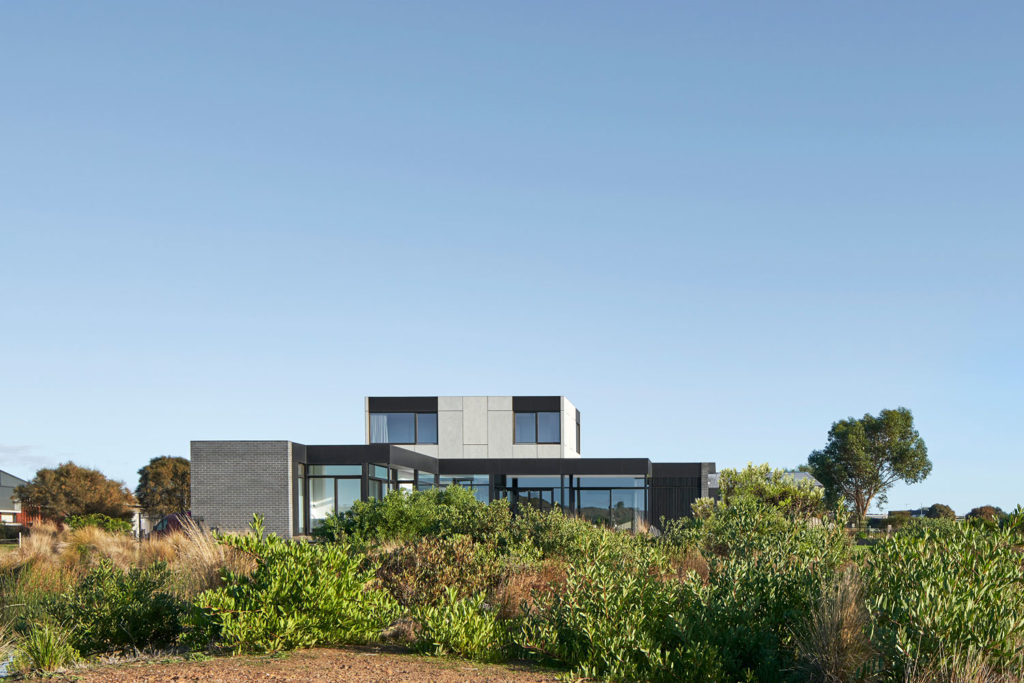 Torquay Beach House, a new contemporary home celebrating raw concrete and exposed brick