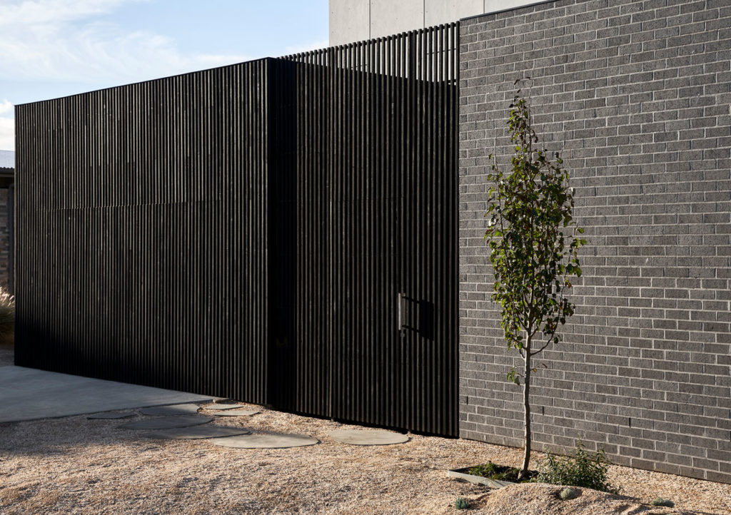 Torquay Beach House, a new contemporary home  celebrating raw concrete and exposed brick