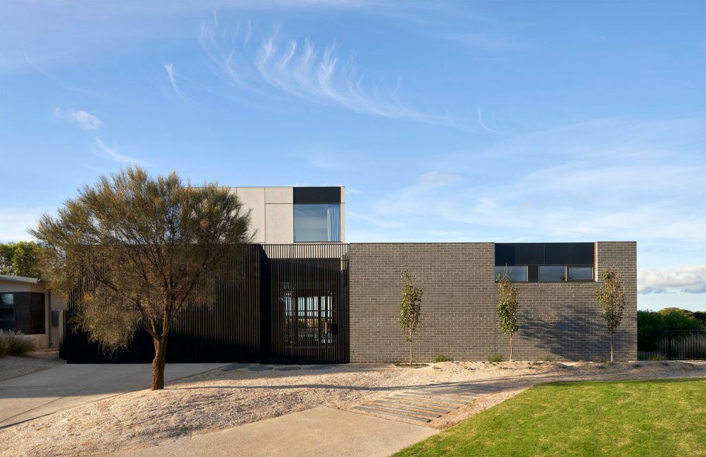 Torquay Beach House, a new contemporary home  celebrating raw concrete and exposed brick