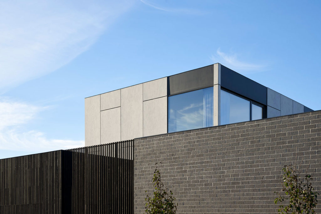 Torquay Beach House, a new contemporary home  celebrating raw concrete and exposed brick