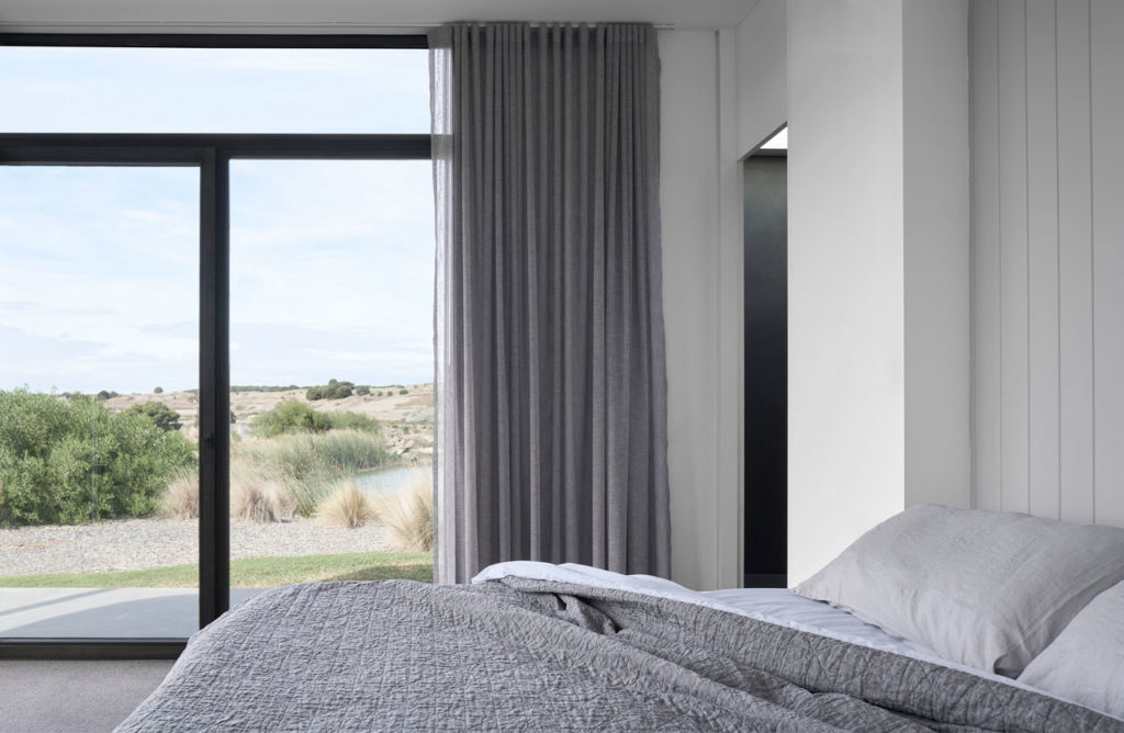 Torquay Beach House, a new contemporary home  celebrating raw concrete and exposed brick