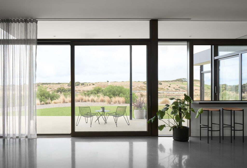 Torquay Beach House, a new contemporary home celebrating raw concrete and exposed brick