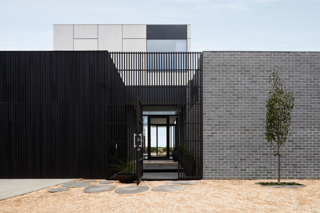 Torquay Beach House, a new contemporary home celebrating raw concrete and exposed brick