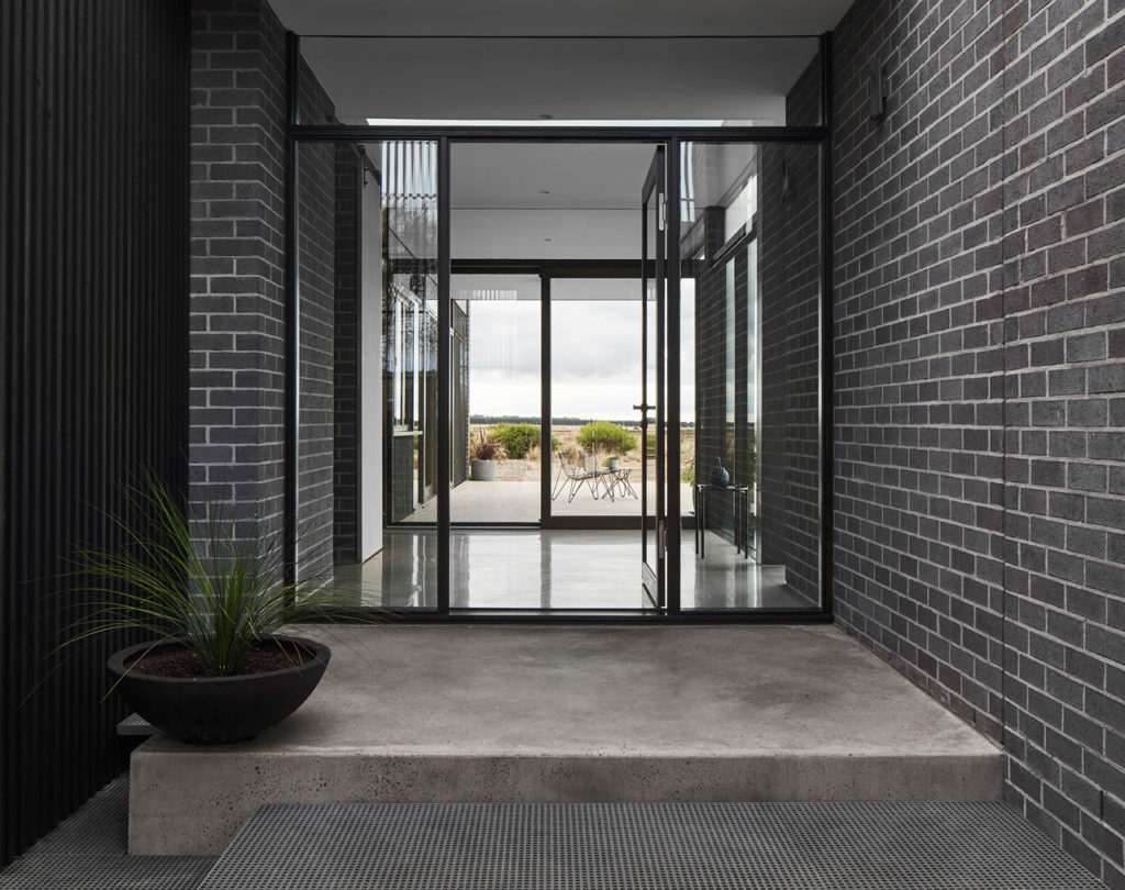 Torquay Beach House, a new contemporary home  celebrating raw concrete and exposed brick