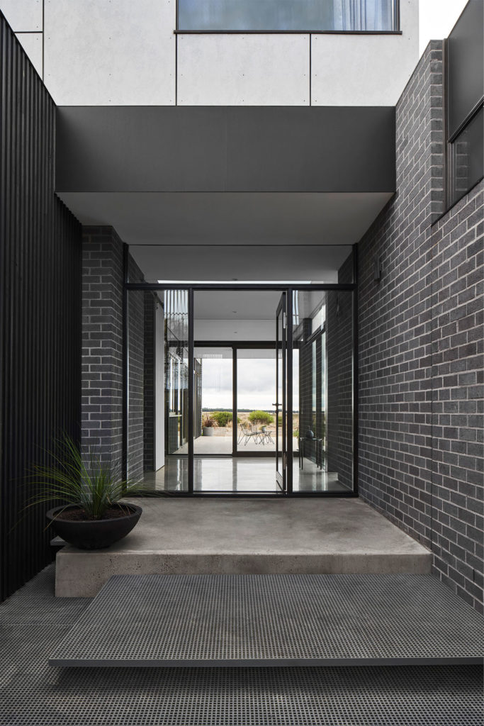 Torquay Beach House, a new contemporary home  celebrating raw concrete and exposed brick