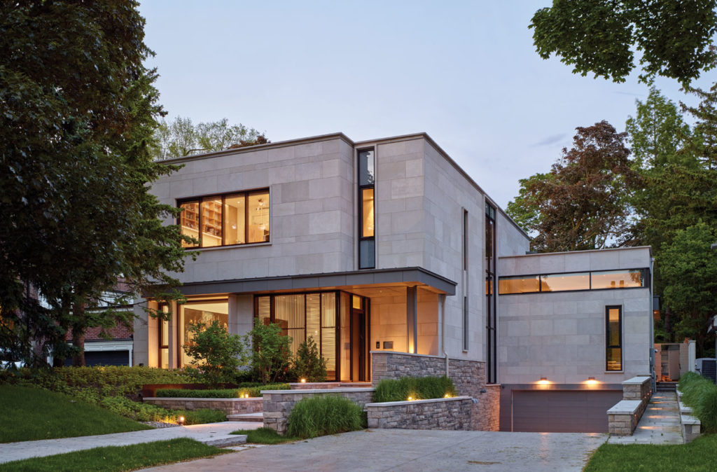 Exterior clad in large slabs of Indiana Limestone with a base of split faced Ontario Algonquin stone.
