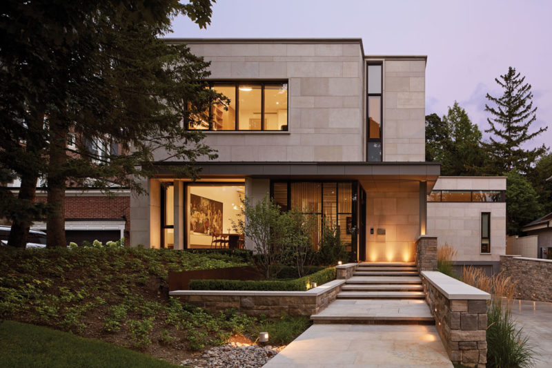 Exterior clad in large slabs of Indiana Limestone with a base of split faced Ontario Algonquin stone  