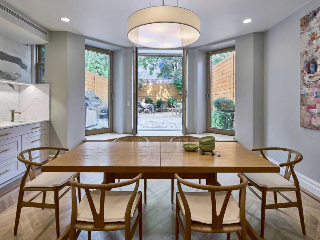 Dining room and garden - Historic Harlem House Modern Restoration by MESH Architectures