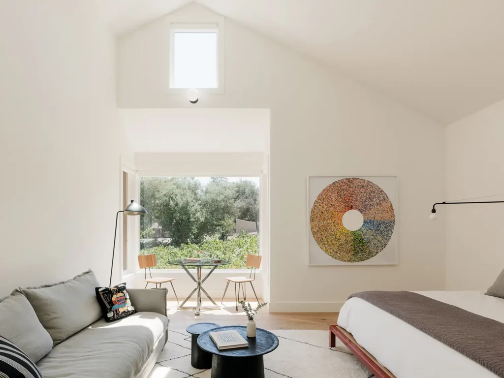 The primary bedroom in the guest house is a tranquil sanctuary that successfully showcases the region's stunning light.