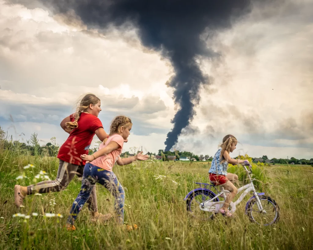 Kids learning how to ride a bicycle in the fields of Ukraine.